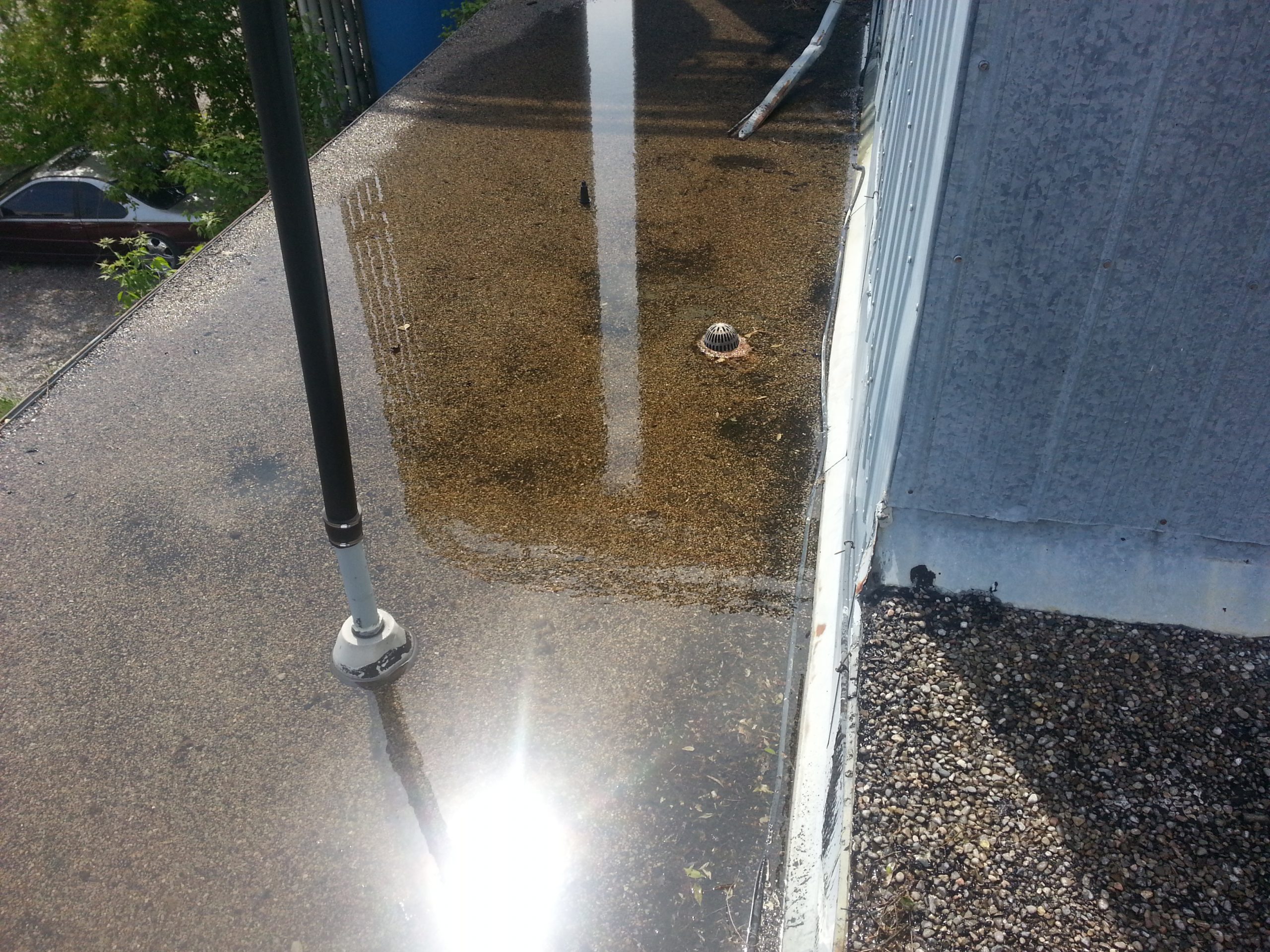 clogged drain ponding water on roof