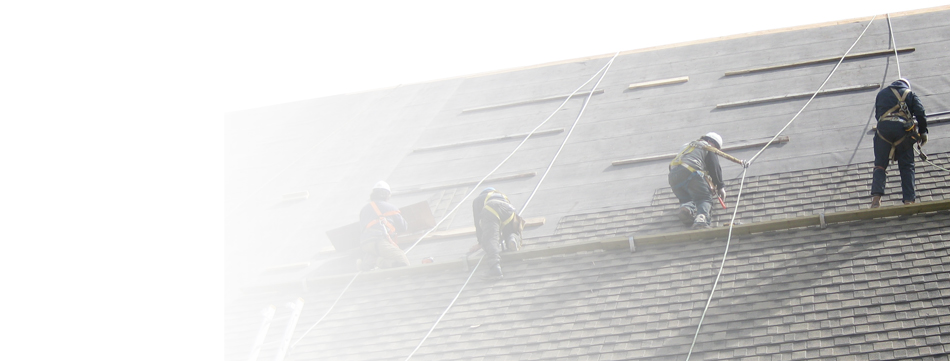 provincial roofing employees shingling steep sloped roof